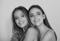 Portrait of two happy smiling cheerful young women. Two beautiful young women with perfect skin in the studio. Woman Royalty Free Stock Photo