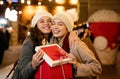 Portrait of happy women exchanging christmas presents. Holiday people christmas happiness concept Royalty Free Stock Photo