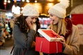 Portrait of happy women exchanging christmas presents. Holiday people christmas happiness concept Royalty Free Stock Photo