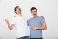 Portrait of two happy young men laughing Royalty Free Stock Photo