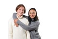 Portrait of two happy young people in warm sweatshirts - brother and sister. Hug and look at the camera. On white background