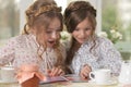 Girls reading magazine Royalty Free Stock Photo
