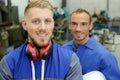 portrait two male engineers in workshop