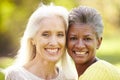 Portrait Of Two Mature Female Friends Hugging Royalty Free Stock Photo