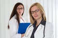 Portrait of Two Medical Colleagues Smiling and Looking at Camera Royalty Free Stock Photo