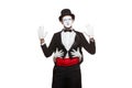 Portrait of two mime artists performing, isolated on white background. Mime hid behind his friend, holding his waist Royalty Free Stock Photo