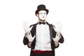 Portrait of two mime artists performing, isolated on white background. Mime hid behind his friend, standing with their