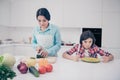 Portrait of two nice cute lovely attractive irritated annoyed bored tired evil girl demanding meal dish mature sweet mom Royalty Free Stock Photo