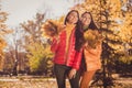 Portrait of two nice-looking attractive pretty friendly cheerful best girlfriends spending free spare time weekend in Royalty Free Stock Photo