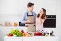 Portrait of two people harmony comfort romantic couple man hug embrace girl tell her joke stand in kitchen with fresh