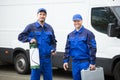 Portrait Of Two Pest Control Workers Royalty Free Stock Photo