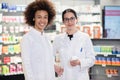 Portrait of two pharmacists smiling with confidence at work Royalty Free Stock Photo