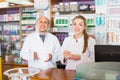 Portrait of two pharmacists working in farmacy