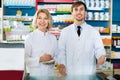 Portrait of two pharmacists working in modern farmacy Royalty Free Stock Photo