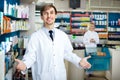 Portrait of two pharmacists working in modern farmacy Royalty Free Stock Photo