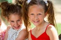 Portrait of two ponytailed girls. Royalty Free Stock Photo
