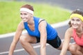 Portrait of Two Pretty Caucasian Sportswomen Having Fun Time