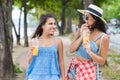 Portrait Of Two Pretty Woman Drinking Fresh Juice While Walk In Park Young Girls Tourists On Vacation Royalty Free Stock Photo
