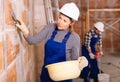 Portrait of two professional builders in process of repair at private house