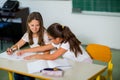 Portrait of two schoolgirls in a classroom. Royalty Free Stock Photo