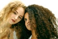 Portrait of two curly girls. Afro and blond Royalty Free Stock Photo