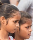 Portrait of two serious looking young indian girls