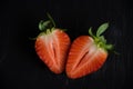 Portrait of two slices of a red strawberry Royalty Free Stock Photo