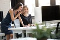 Portrait of two smiling business woman working in office Royalty Free Stock Photo