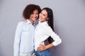 Portrait of a two smiling girls standing together Royalty Free Stock Photo
