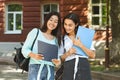 Portrait Of Two Smiling Student Girls Discussing Study Project Outdoors Royalty Free Stock Photo