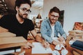 Portrait of Two Smiling Writers Working Indoors