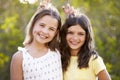 Portrait of two smiling young girls have posing to camera Royalty Free Stock Photo