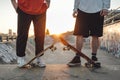 Two friends skaters with skateboards at skate park Royalty Free Stock Photo