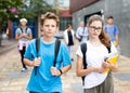 Two teenage students going to college on autumn day Royalty Free Stock Photo