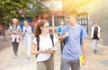 Two teenage students going to college on autumn day Royalty Free Stock Photo