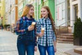 Portrait of two teenager girls standing together eating ice cream Royalty Free Stock Photo