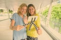 Two tourist women exploring together the city of Bangkok, Thailand