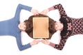 Portrait of two twins sisters with long hair and cork board