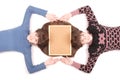 Portrait of two twins sisters with long hair and cork board