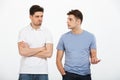 Full length portrait of two upset young men arguing Royalty Free Stock Photo