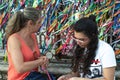 Portrait of two women against colored ribbons in the background Royalty Free Stock Photo