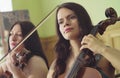 Portrait of two women playing music Royalty Free Stock Photo