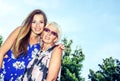 Portrait of two women in the summer outdoors. Mother and daughter hugging. Grandmother and granddaughter. Royalty Free Stock Photo