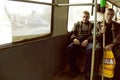 Portrait of two working class men commuting in bus