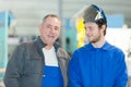 Portrait two workmen one wearing visor Royalty Free Stock Photo