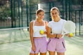 Portrait of two young women padel tennis players Royalty Free Stock Photo