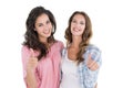 Portrait of two young female friends gesturing thumbs up Royalty Free Stock Photo