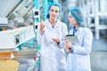 Two Young Women Working at Food Factory