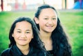 Portrait of two young Maori sisters