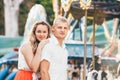 Portrait of two young people walking at the city park posing at the camera. Sensual feelings of in love couples concept image Royalty Free Stock Photo
